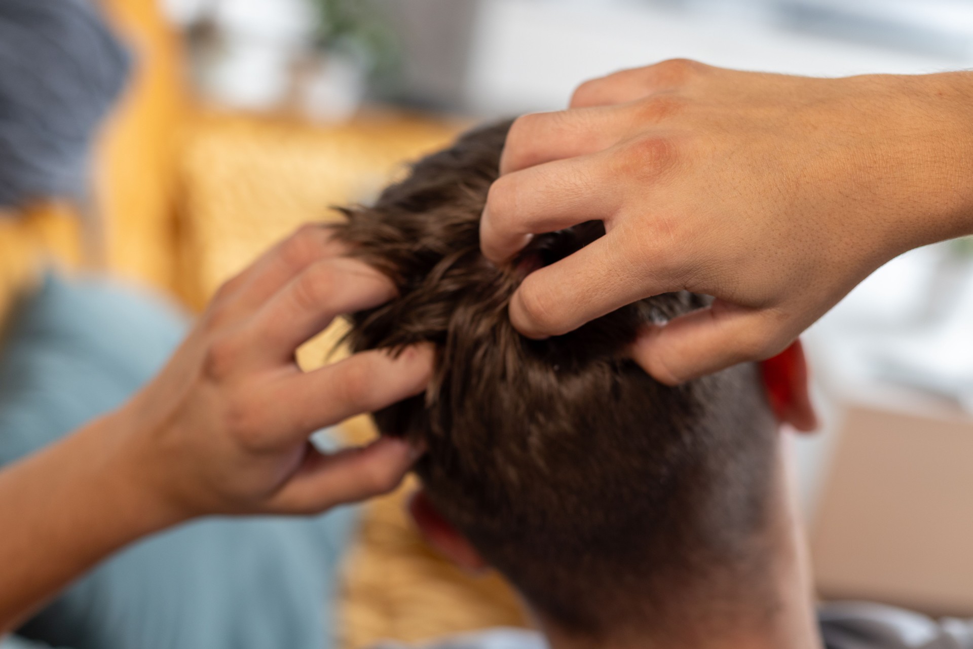 Close-Up of Head Massage Showing Hands Applying Relaxation Techniques